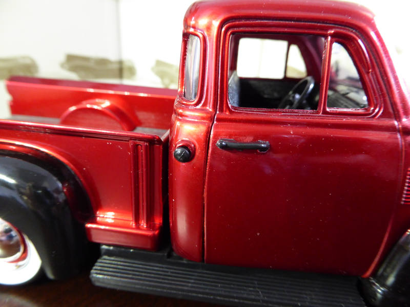 Gas cap and door handles are separate parts. No gap on the door when pictured in close up.